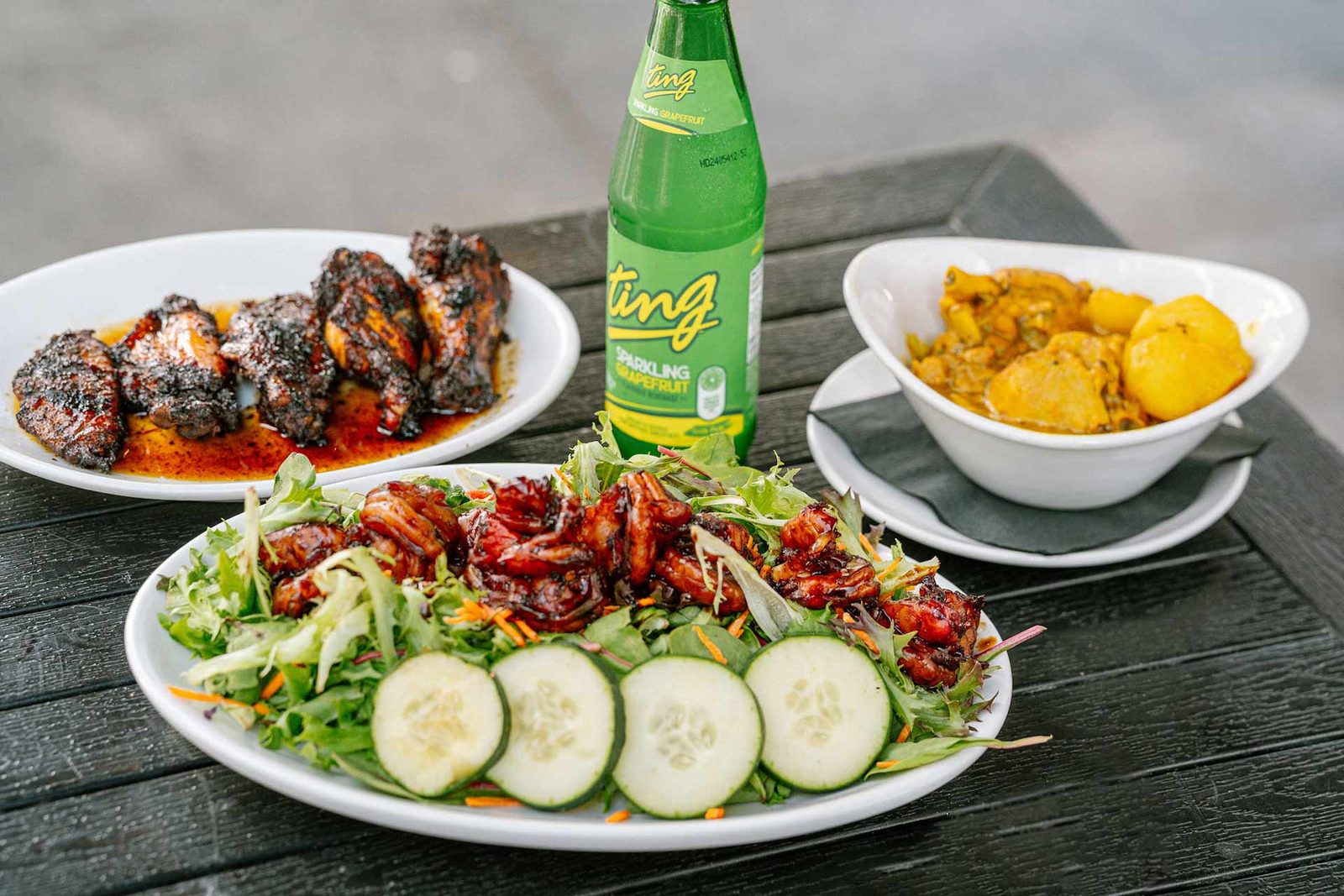 Jerk wings, a jerk shrimp salad and curry
