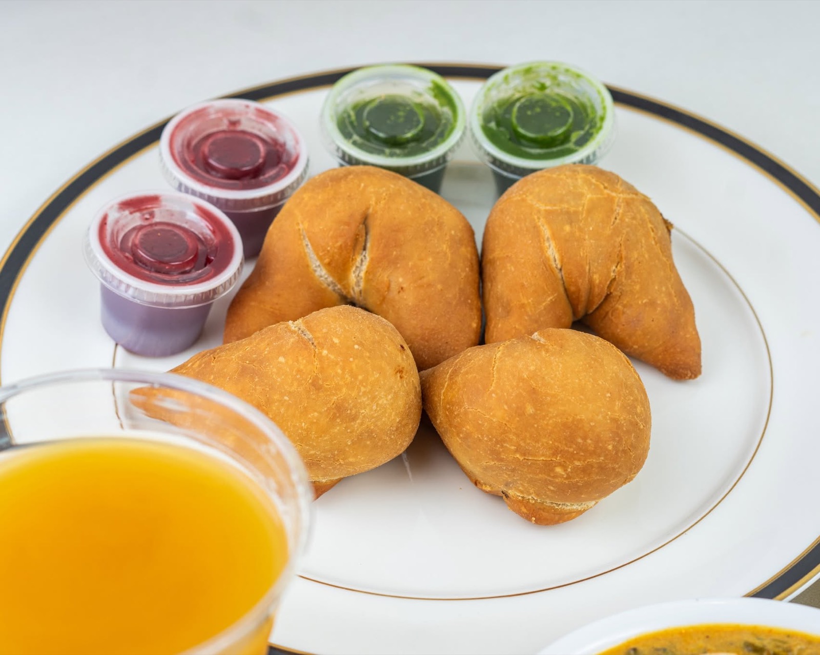 Samosas with tamarind and mint chutney
